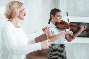 Positive nice girl practicing her music skills